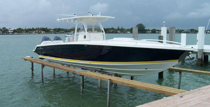 large boat on hydraulic boat lift